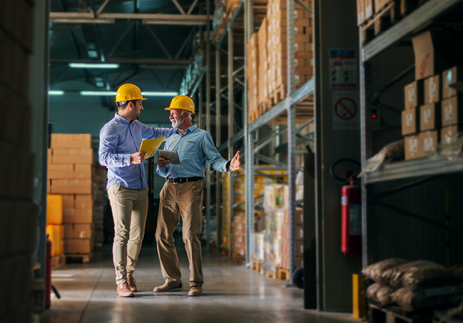Men Talking in Warehouse